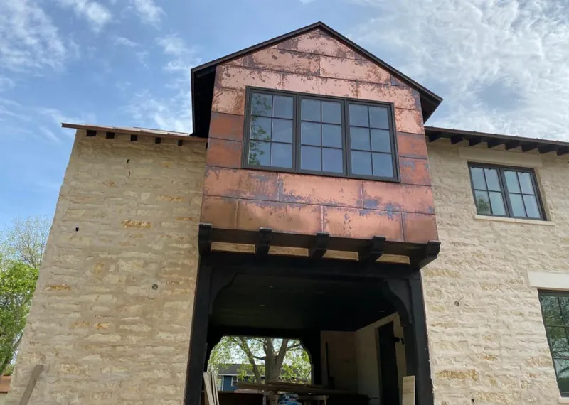 Copper metal panel facade on a stone building for Skylight Installation in Matawan
